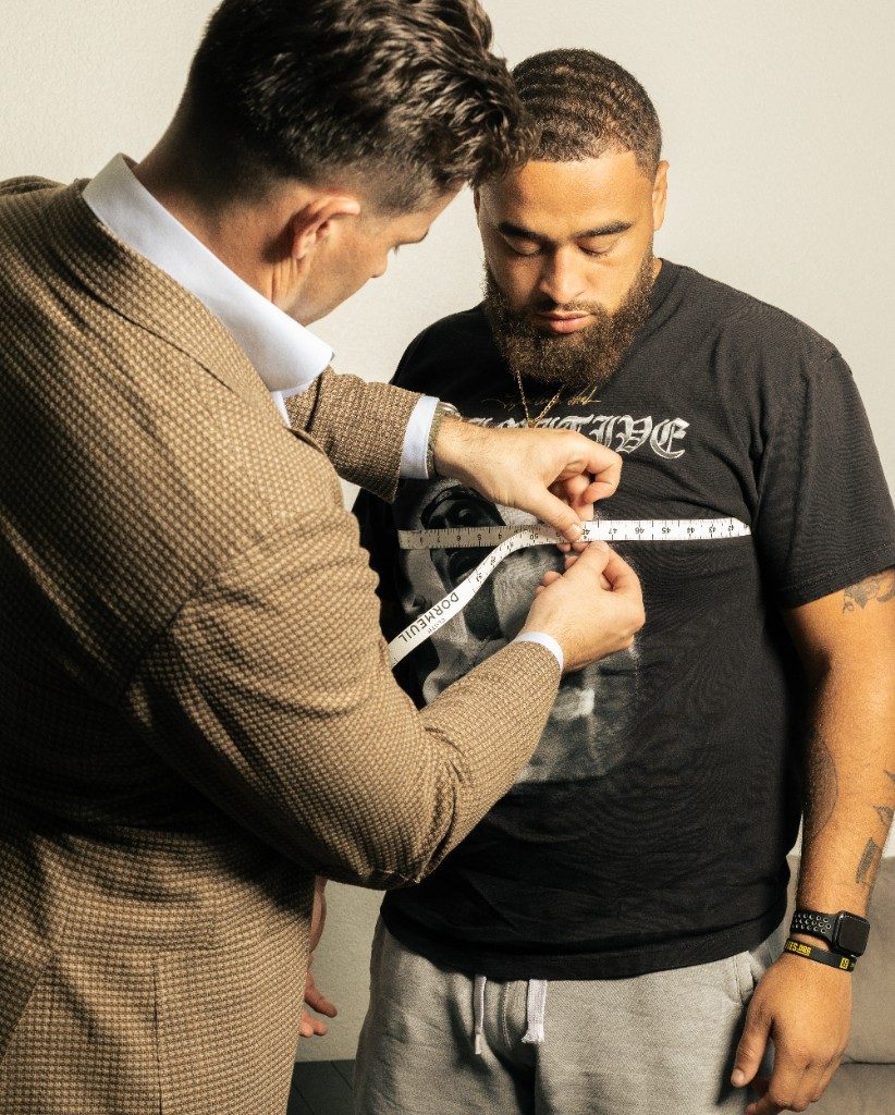 Chest measurement during a private bespoke fitting appointment