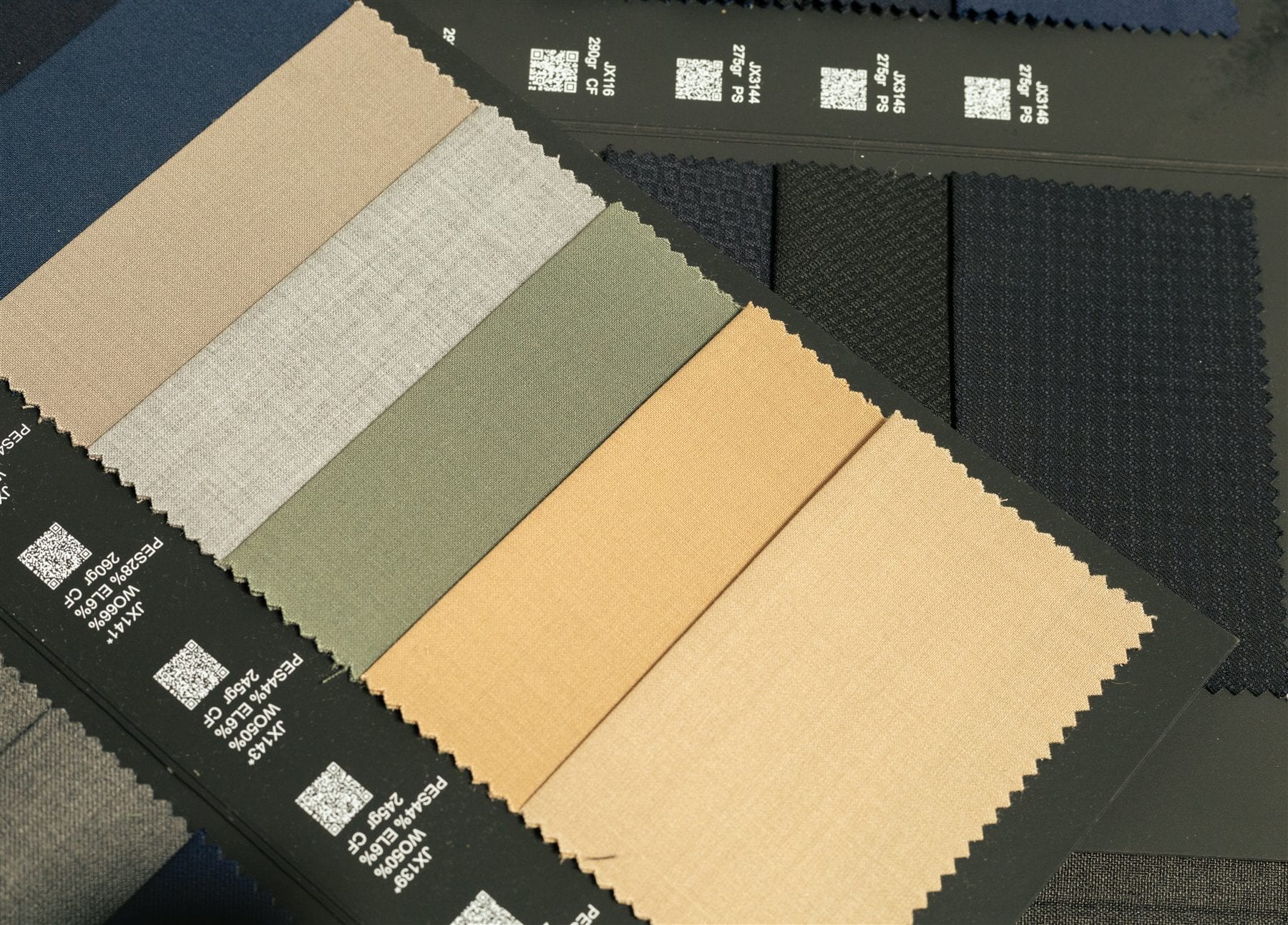 Custom suit fabric books during a Tailored Threads style consultation