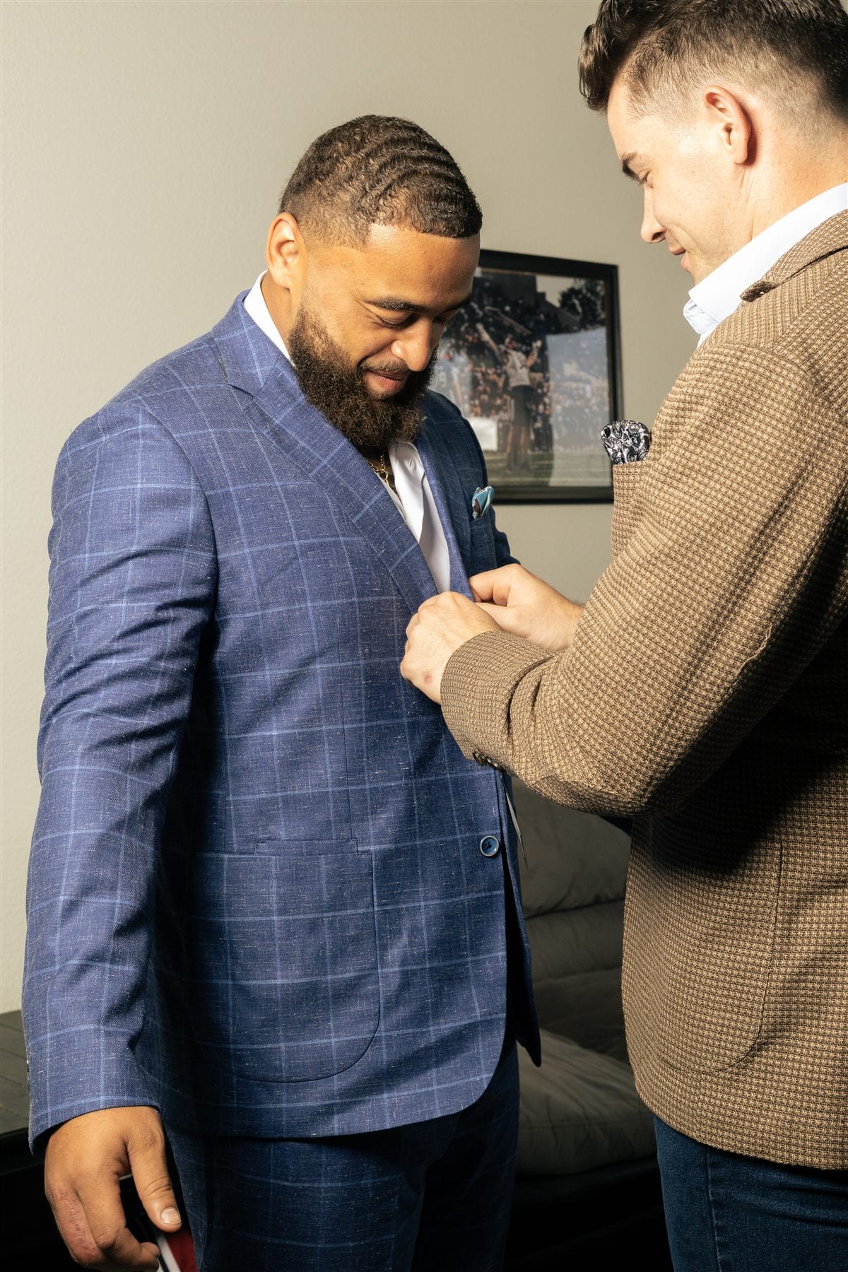 Custom suit fitting with jacket adjustment during private appointment