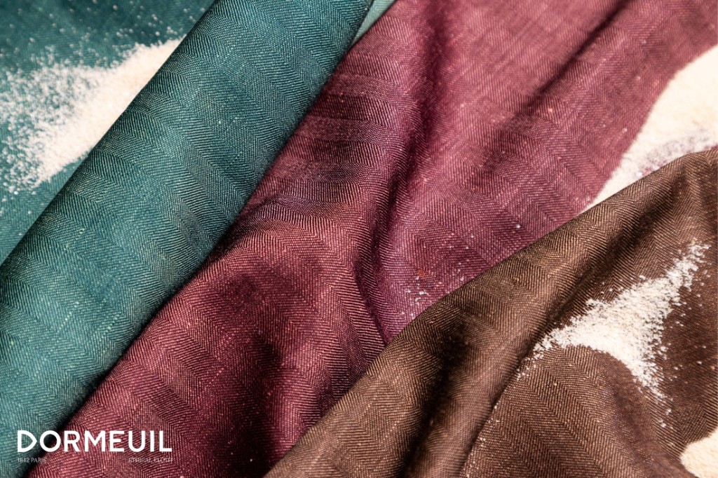 Dormeuil Naturals fabric swatches in teal, burgundy, and brown herringbone weaves