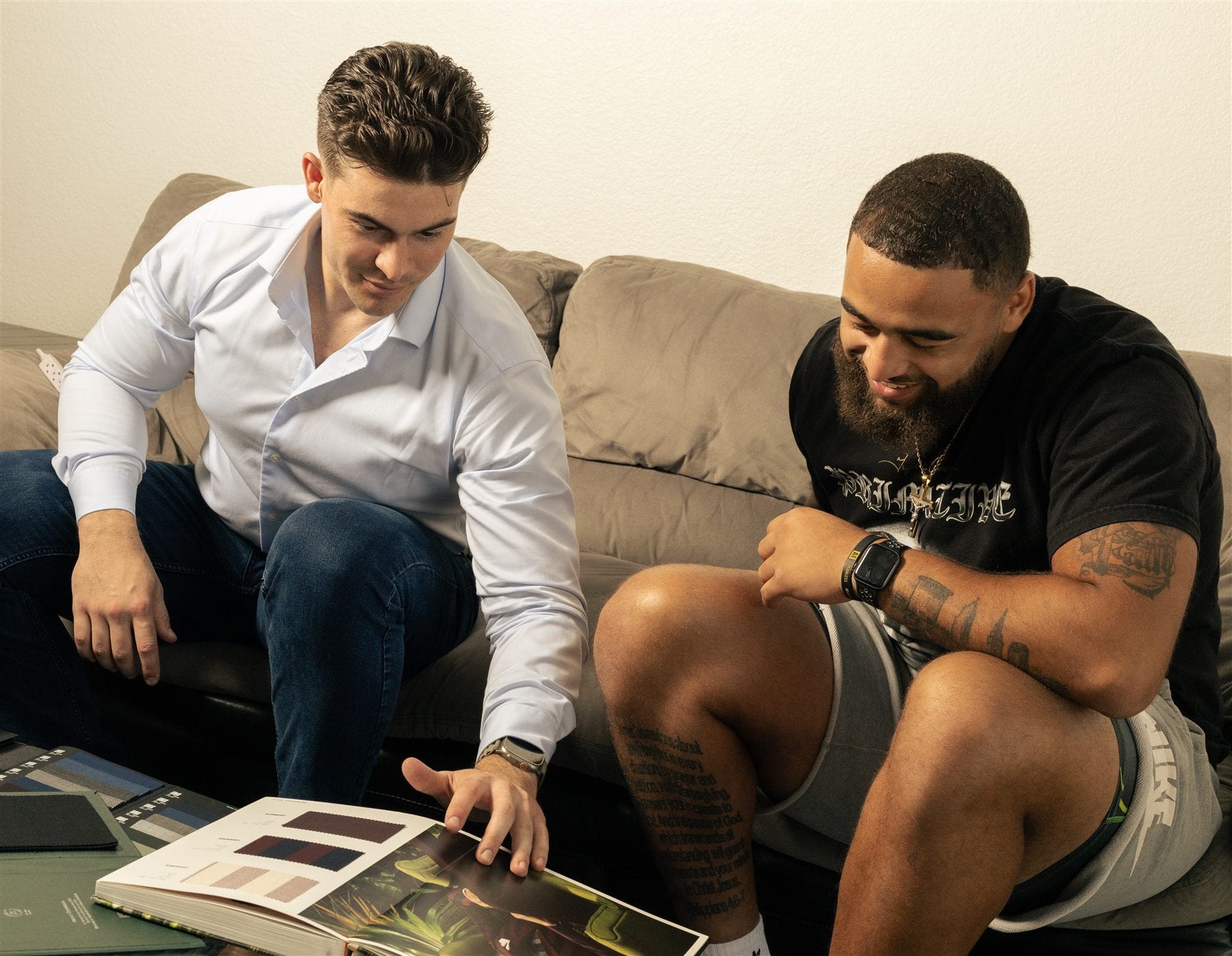 Private custom suit fitting with fabric books and style consultation